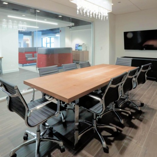 The essence of exceptional living a conference room with a large table surrounded by chairs
