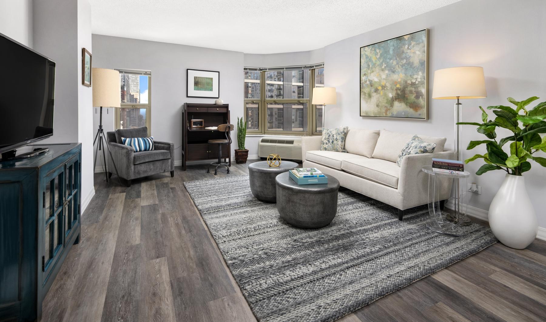 Generous living spaces to relax and unwind spacious living room with windows