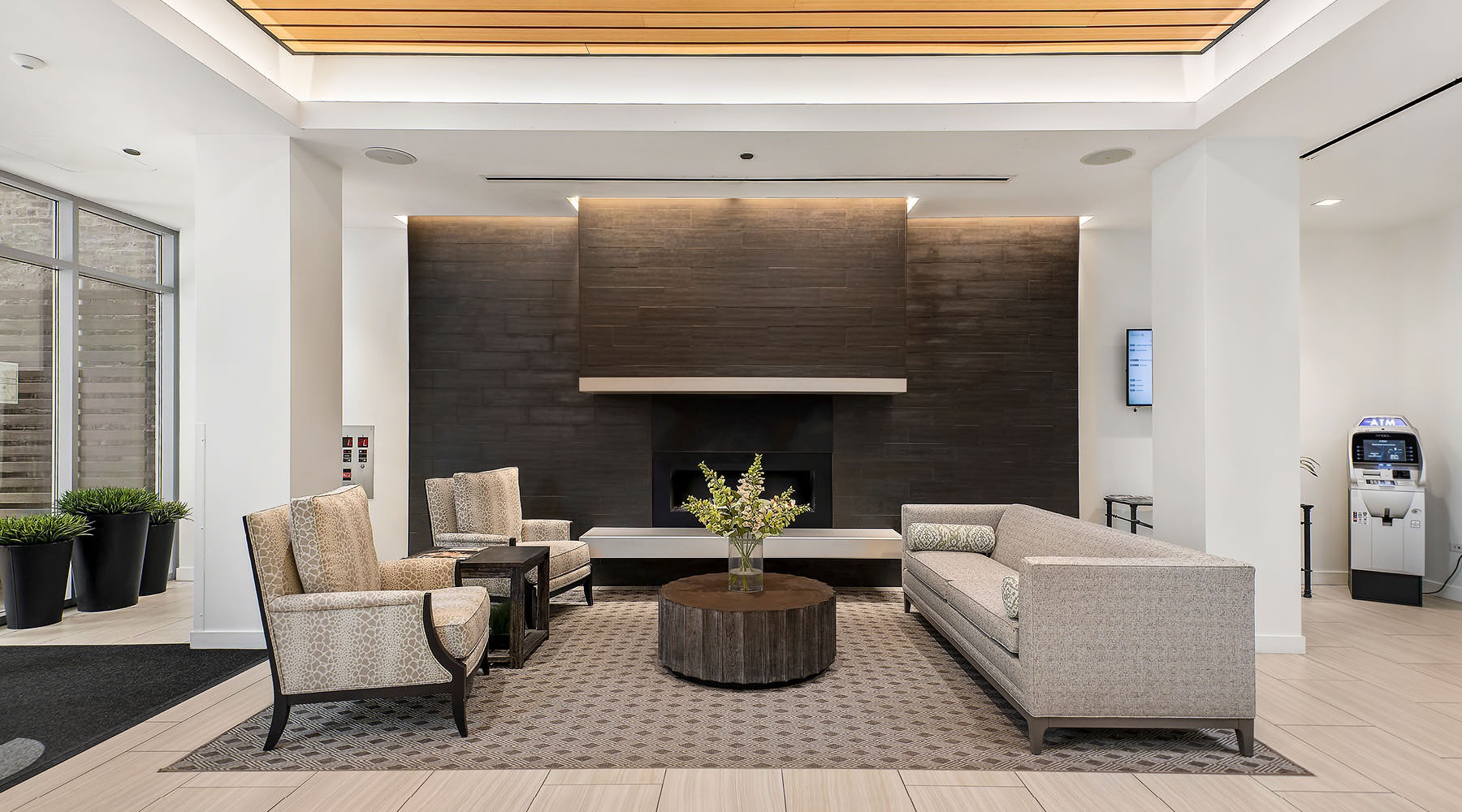Welcome to Chestnut Place bright lobby with a couch and chairs
